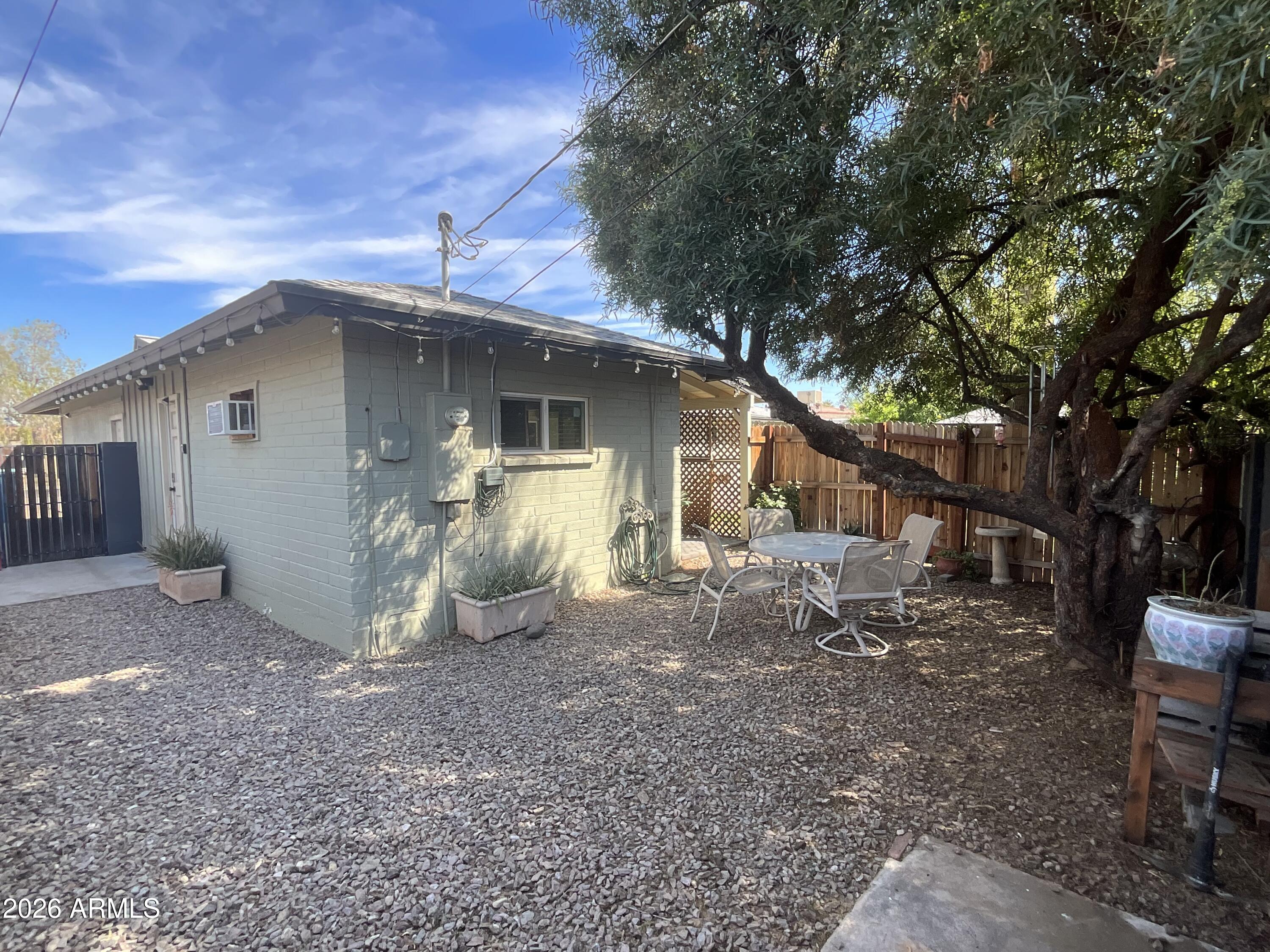 1601 West Lamar Road Phoenix, AZ 85015 - Photo 21 of 28 a view of a small house with a yard