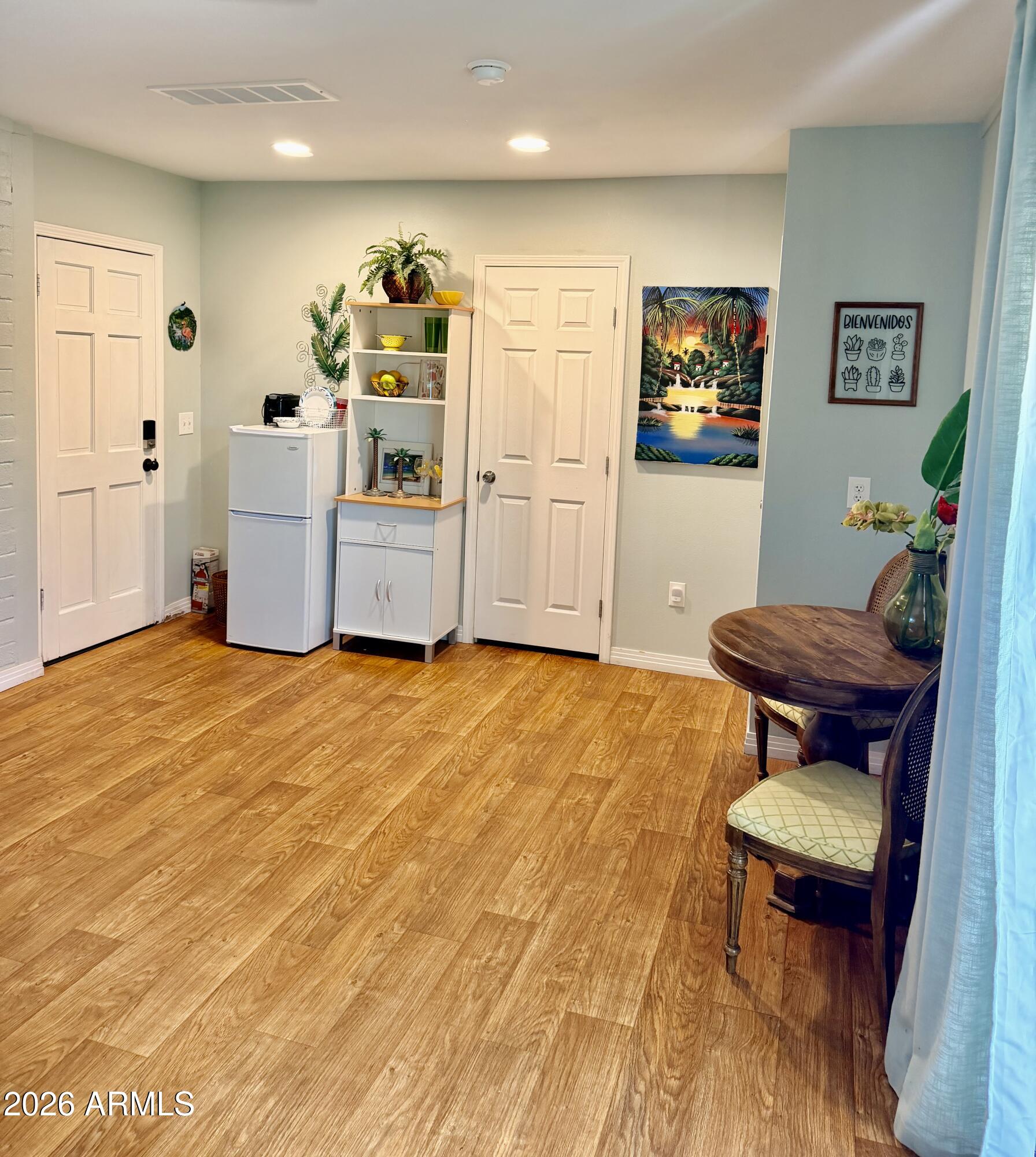1601 West Lamar Road Phoenix, AZ 85015 - Photo 23 of 28 a living room with furniture and a wooden floor
