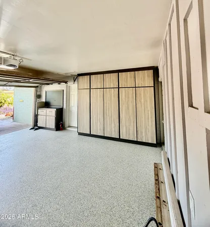 a view of a car garage with wooden floor