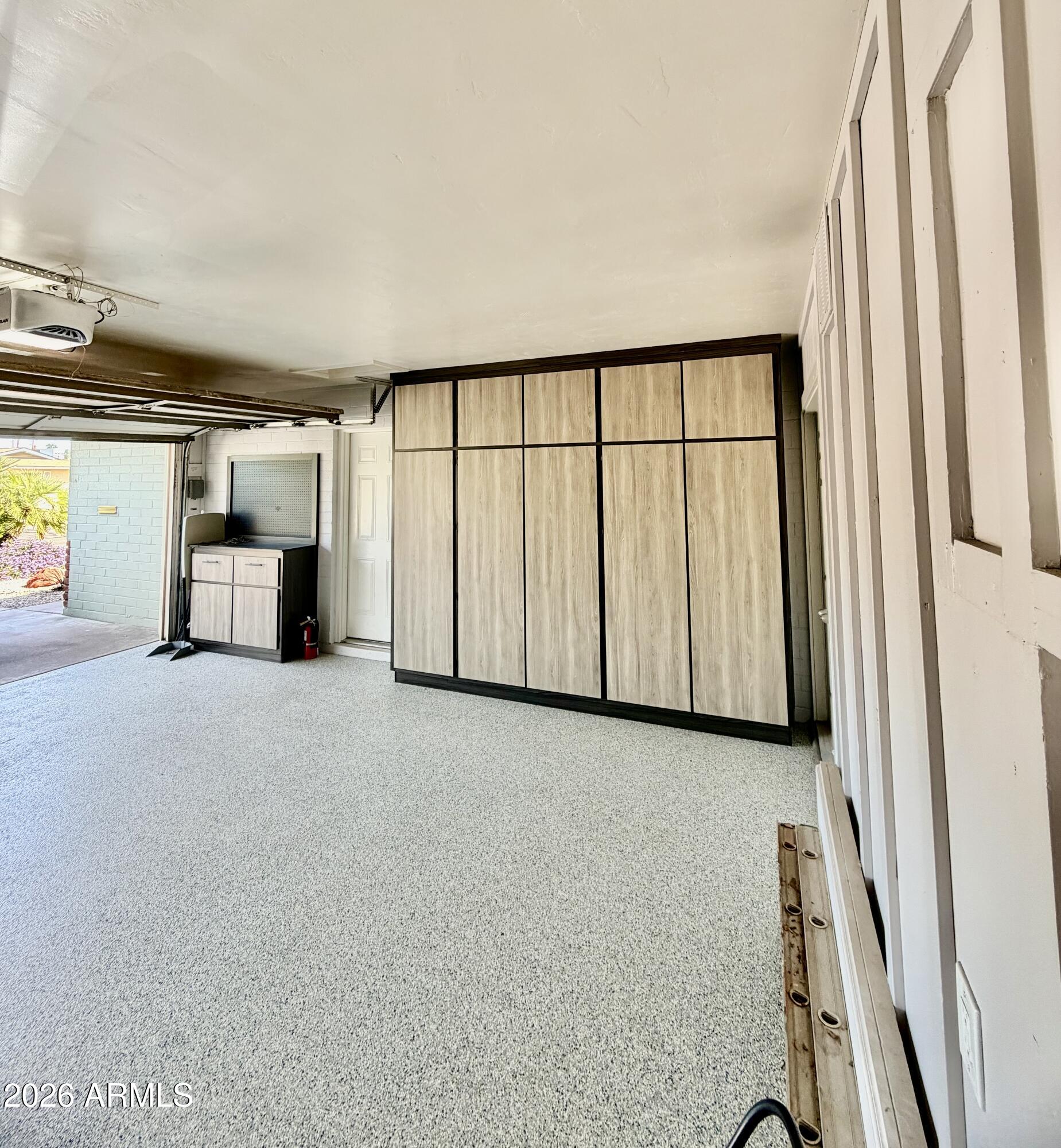 1601 West Lamar Road Phoenix, AZ 85015 - Photo 27 of 28 a view of a car garage with wooden floor