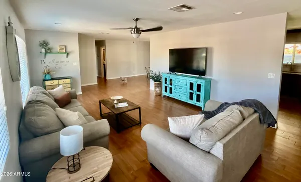 a living room with furniture and a flat screen tv