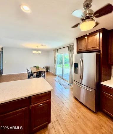 a kitchen with stainless steel appliances a sink and a refrigerator