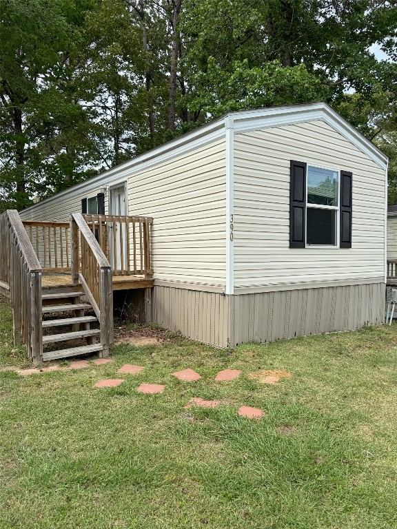 390 Hidden Oaks Drive Point Blank, TX 77364 - Photo 1 of 7 a view of a house with a yard