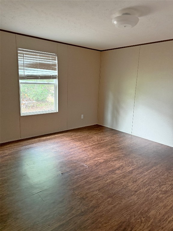 390 Hidden Oaks Drive Point Blank, TX 77364 - Photo 6 of 7 an empty room with wooden floor and windows