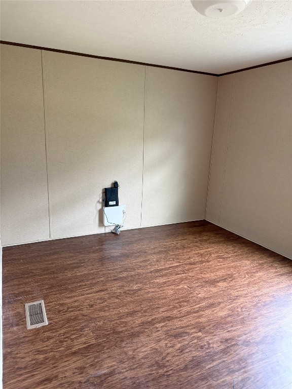 390 Hidden Oaks Drive Point Blank, TX 77364 - Photo 7 of 7 a view of a room with wooden floor and cabinet