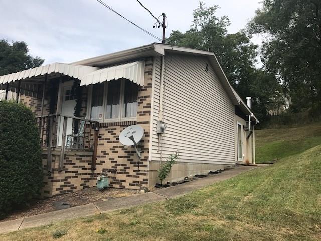 741 Wolf Avenue Rochester, PA 15074 - Photo 4 of 22 a view of a house with a yard