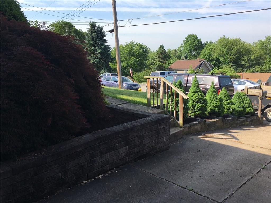 741 Wolf Avenue Rochester, PA 15074 - Photo 5 of 22 a view of a terrace with a garden