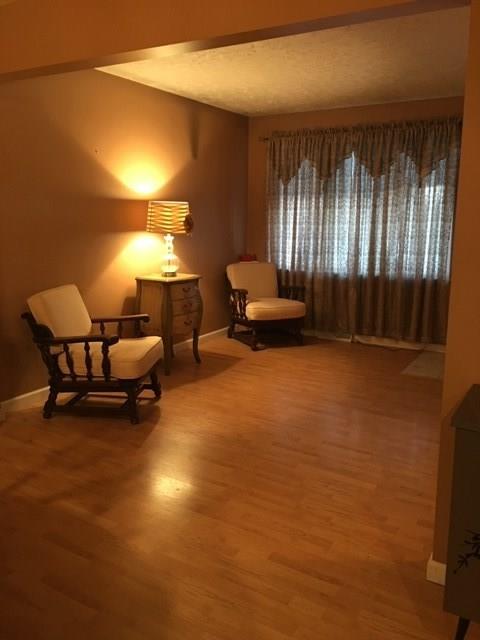 741 Wolf Avenue Rochester, PA 15074 - Photo 6 of 22 a living room with furniture and a large window