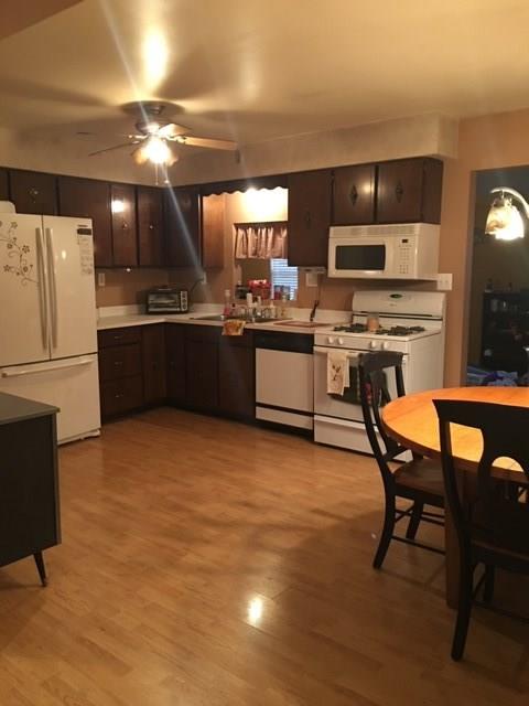 741 Wolf Avenue Rochester, PA 15074 - Photo 8 of 22 a kitchen with stainless steel appliances granite countertop a stove refrigerator and a stove