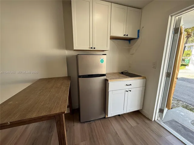 a kitchen with appliances and cabinets