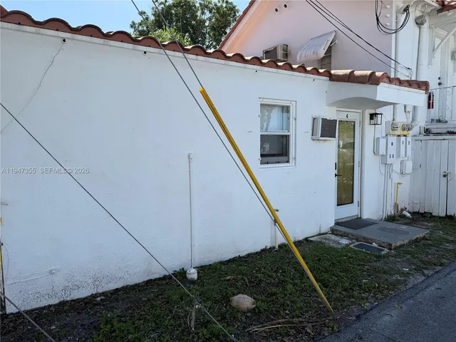 a house view with a backyard space