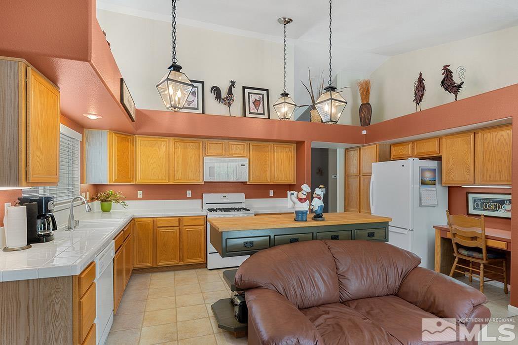 5471 Morning Star Drive Reno, NV 89523 - Photo 8 of 22 a living room with stainless steel appliances kitchen island granite countertop furniture and a view of kitchen