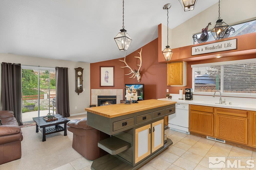 5471 Morning Star Drive Reno, NV 89523 - Photo 9 of 22 a room with furniture a large window and a chandelier