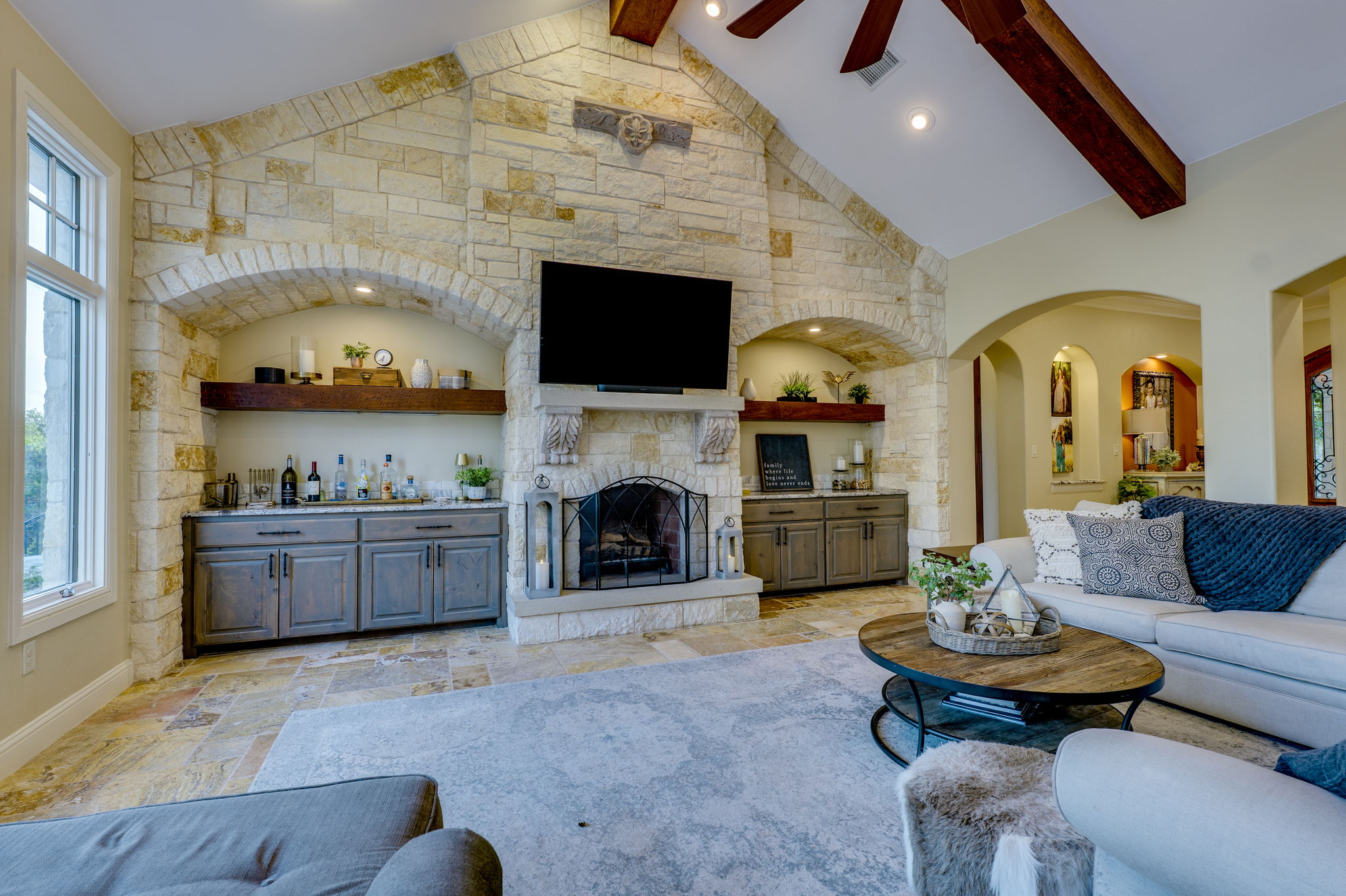 2703 Pyramid Drive Austin, TX 78734 - Photo 14 of 37 a living room with furniture a fireplace and a flat screen tv