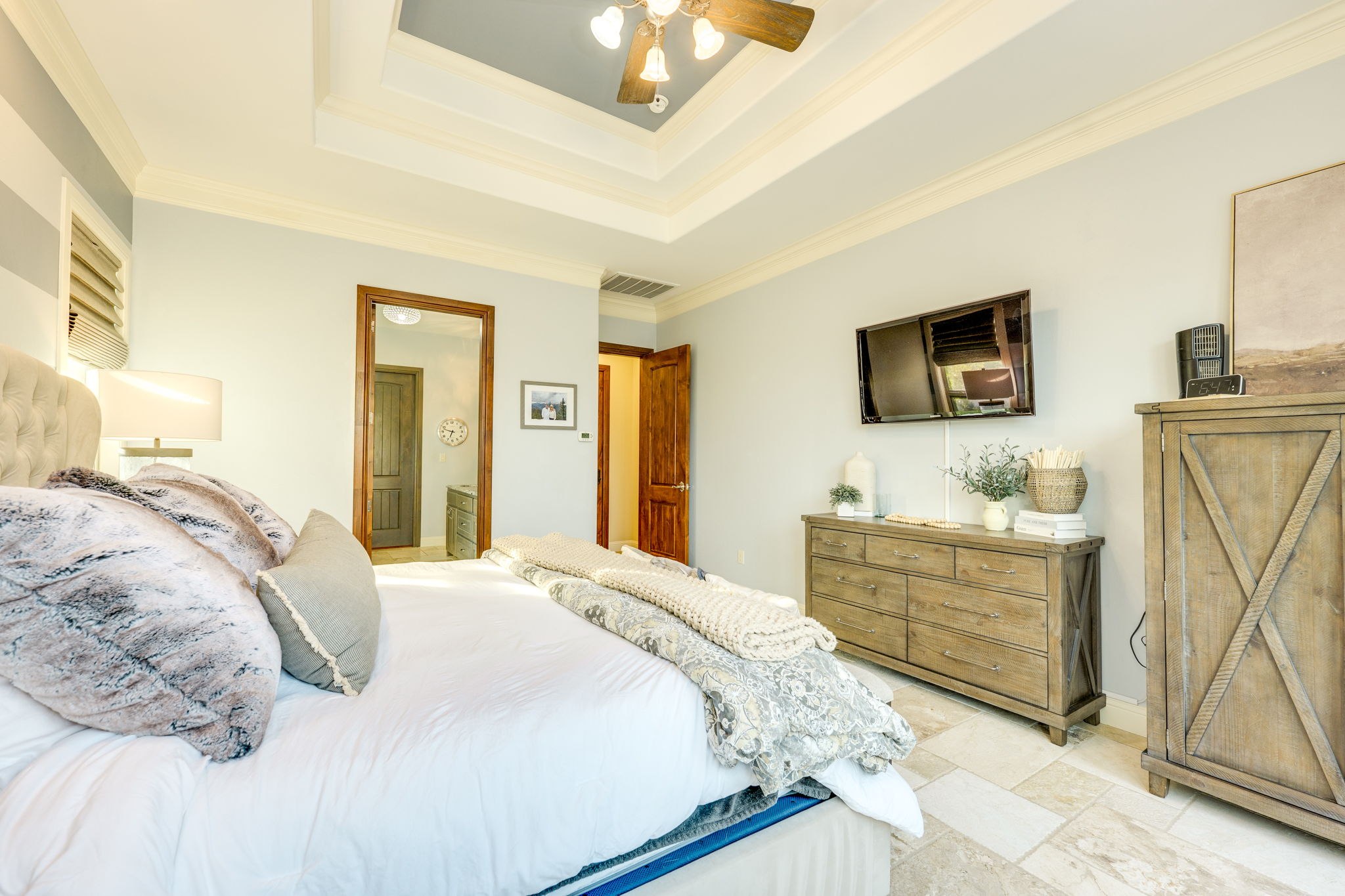 2703 Pyramid Drive Austin, TX 78734 - Photo 21 of 37 a bedroom with a bed and a flat screen tv