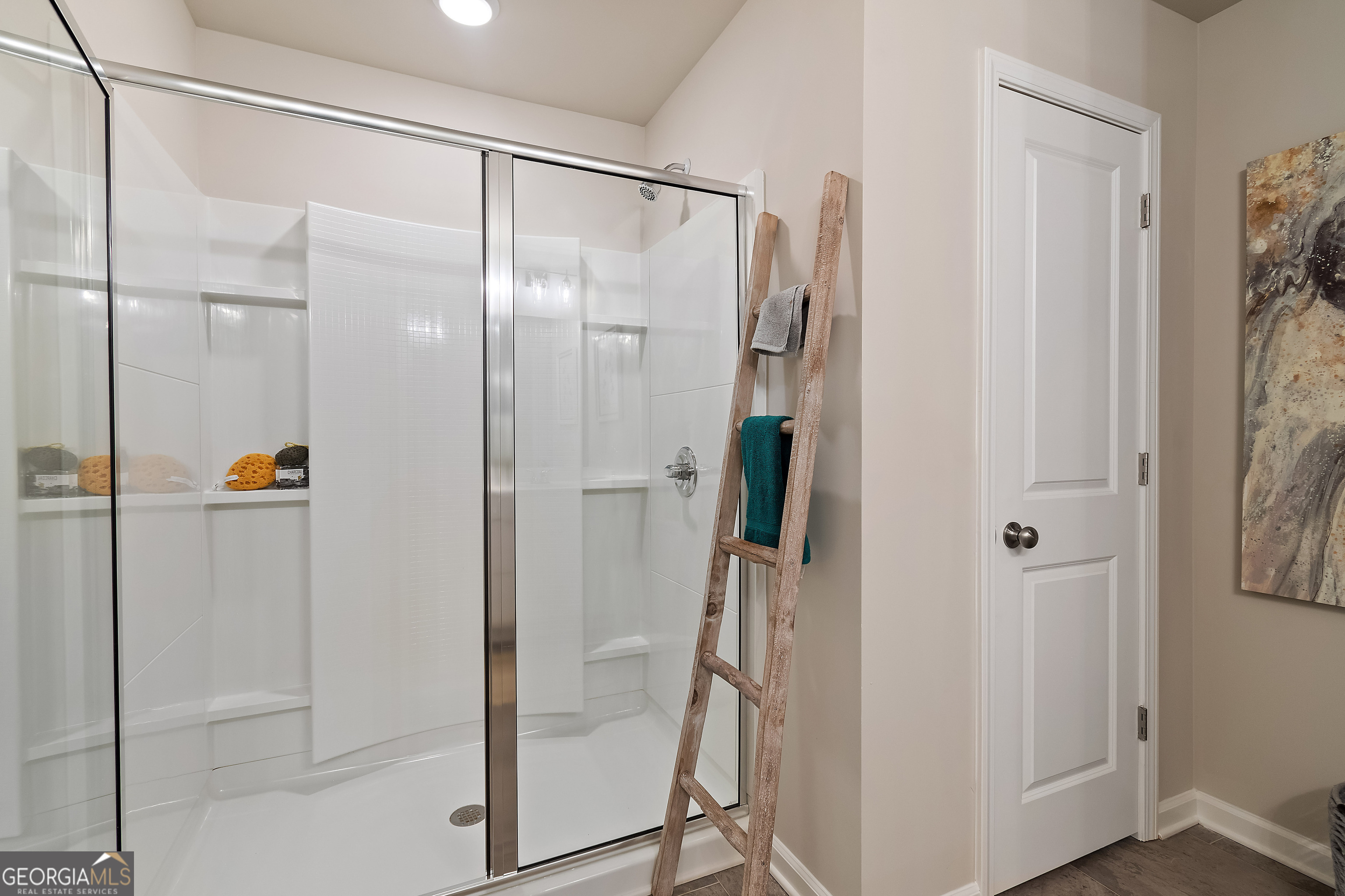 35 Cobalt Lane, Unit 81 Newnan, GA 30265 - Photo 22 of 30 a bathroom with a glass shower door and a glass door
