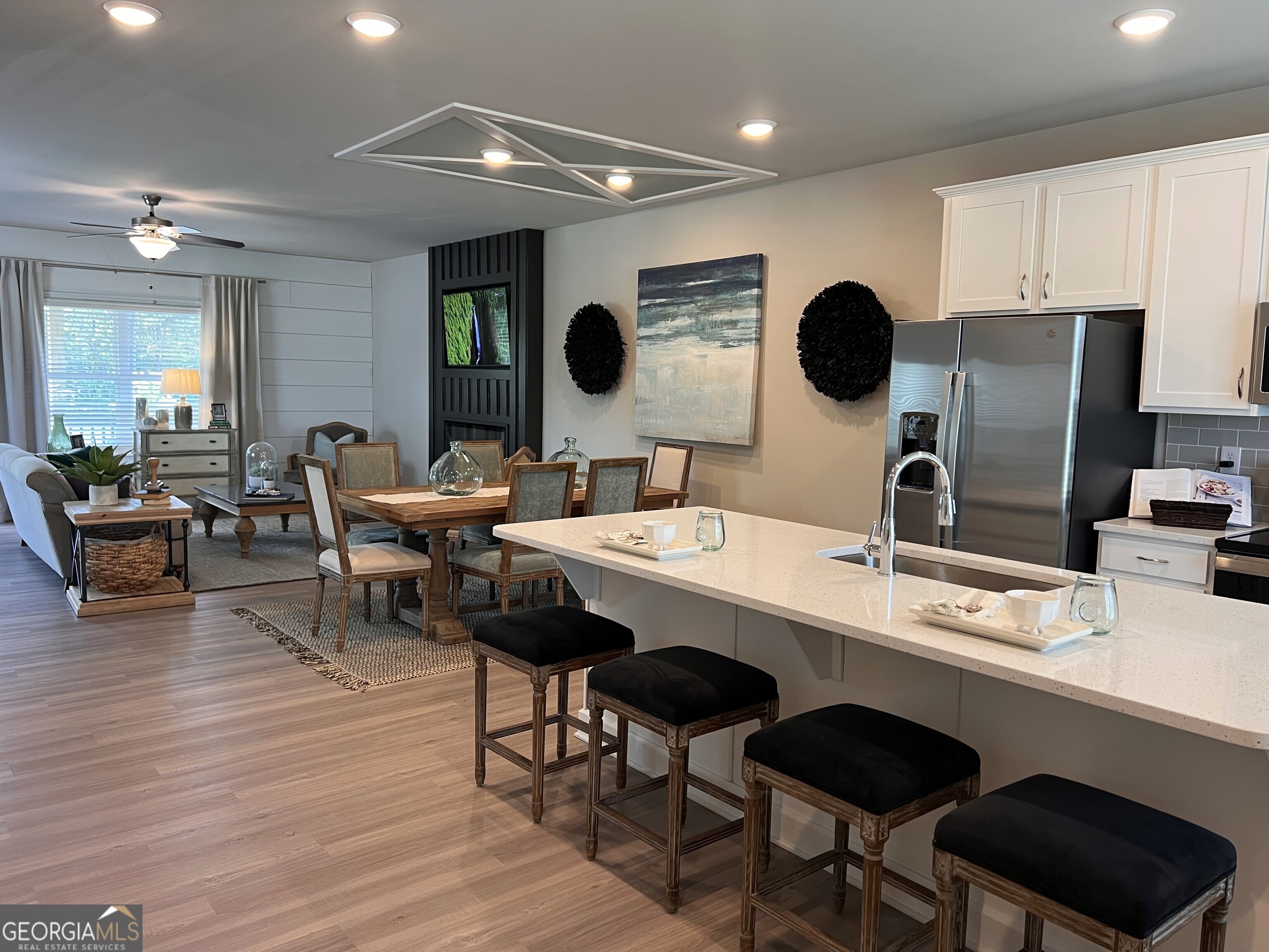 35 Cobalt Lane, Unit 81 Newnan, GA 30265 - Photo 8 of 30 a room with a table chairs and a refrigerator