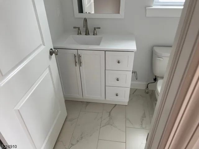 a bathroom with a shower and toilet