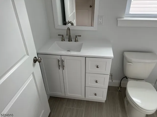 a bathroom with a tub and a window