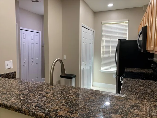 a view of a livingroom with furniture and a window