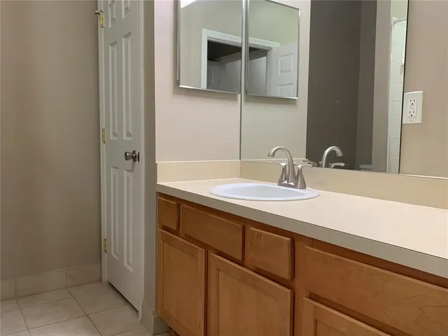 a white toilet sitting next to a shower