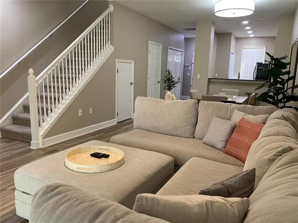 a living room with furniture and a table