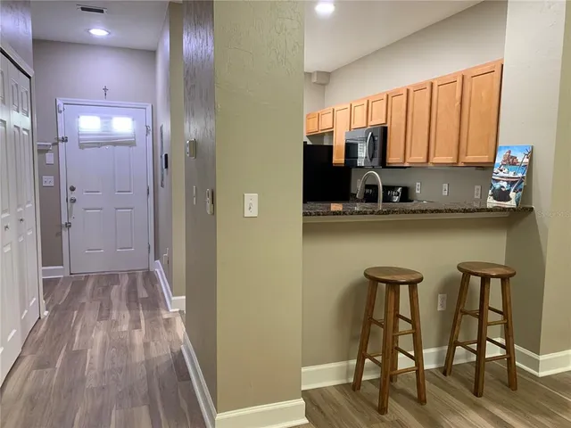 a kitchen with a table and chairs in it
