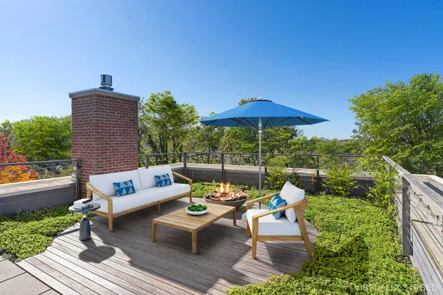 a outdoor sitting area with furniture and wooden deck