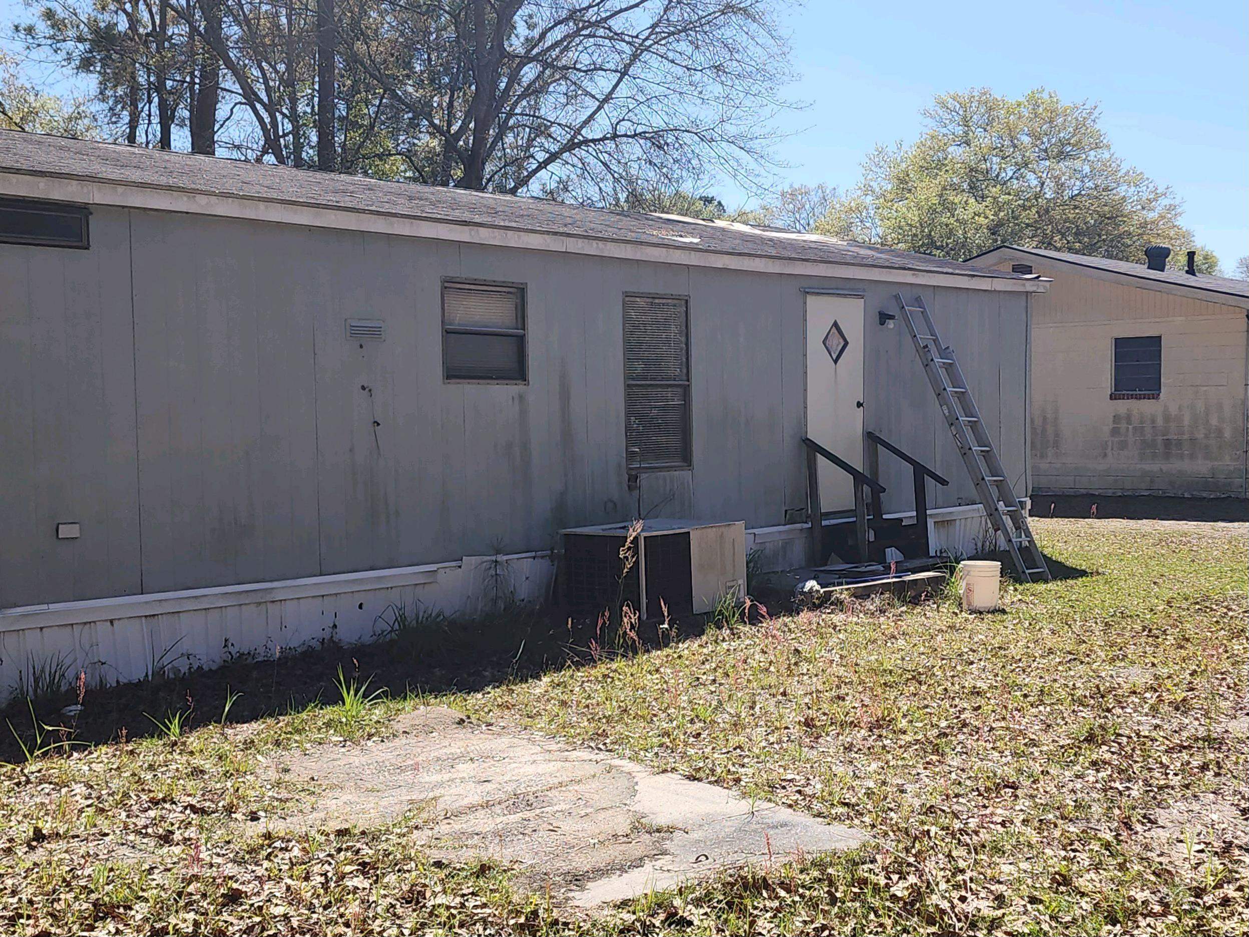 143 Williams Road Pembroke, GA 31321 - Photo 1 of 1 a view of a house with a yard