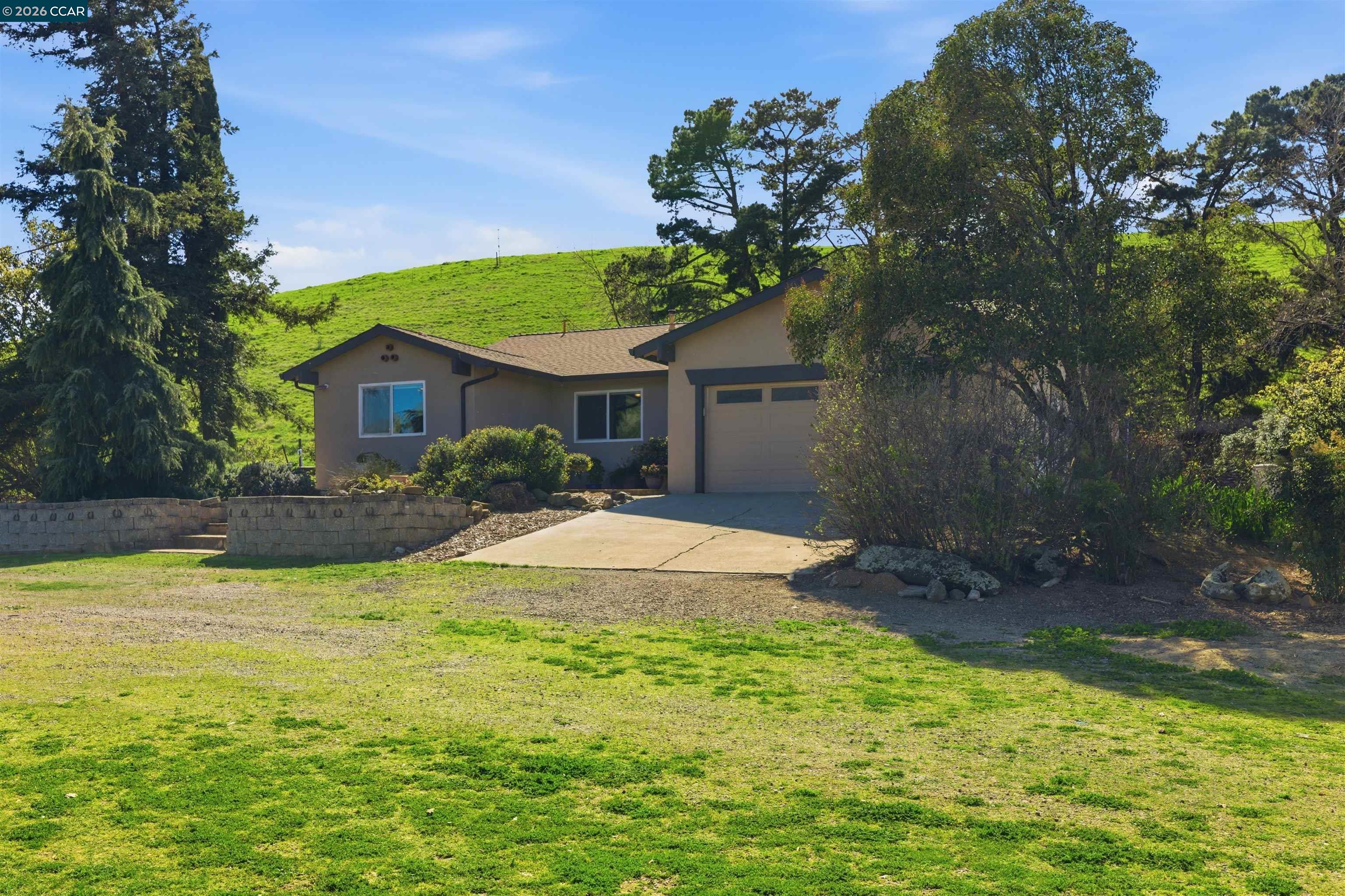 9530 Morgan Territory Road Livermore, CA 94551 - Photo 3 of 55 a front view of a house with garden