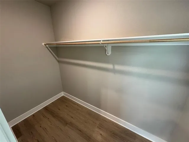 a view of a small space with wooden floor