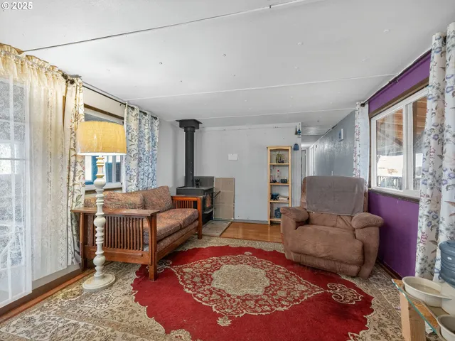 a living room with furniture and a rug