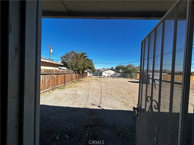 a view of a backyard of the house