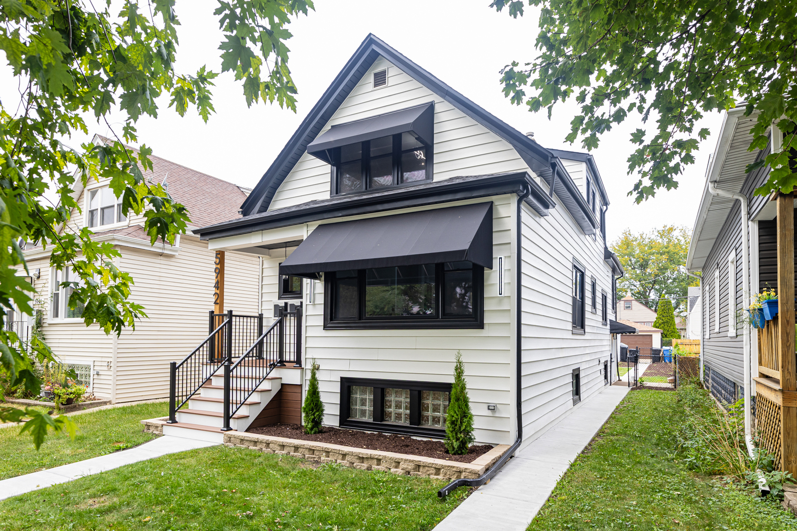 5942 West Eastwood Avenue, Unit 1 Chicago, IL 60630 - Photo 1 of 17 a view of house with garden and entertaining space