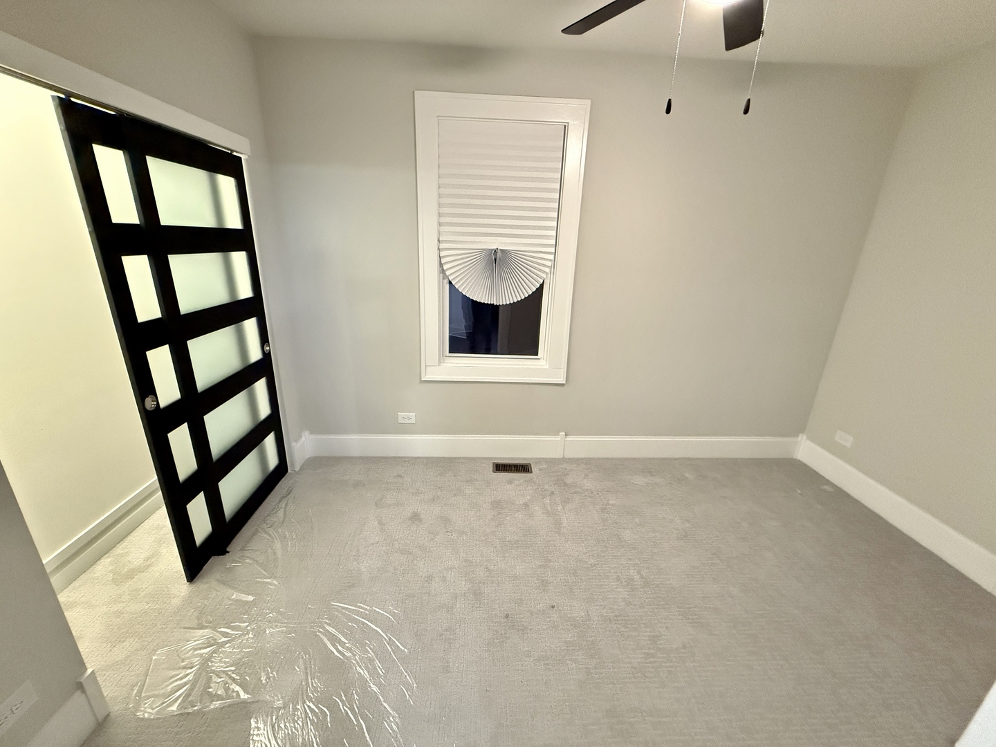 5942 West Eastwood Avenue, Unit 1 Chicago, IL 60630 - Photo 14 of 17 wooden floor in an empty room with a window