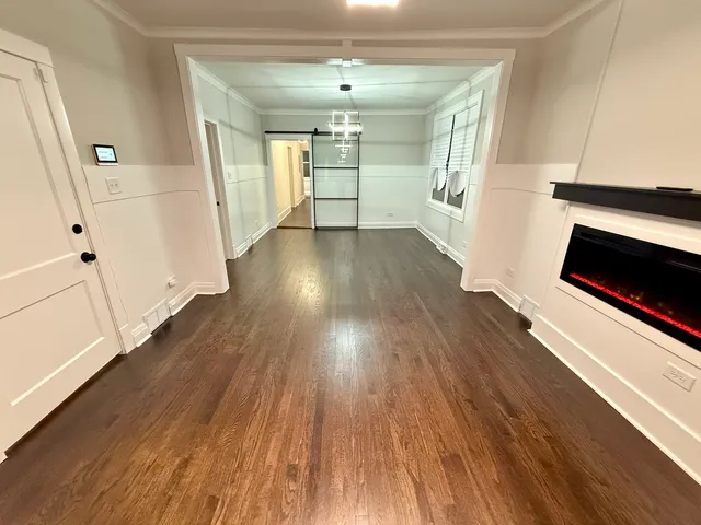 wooden floor in an empty room with a fireplace