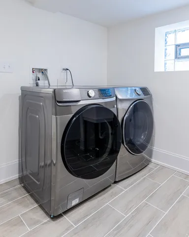 a utility room with dryer and washer