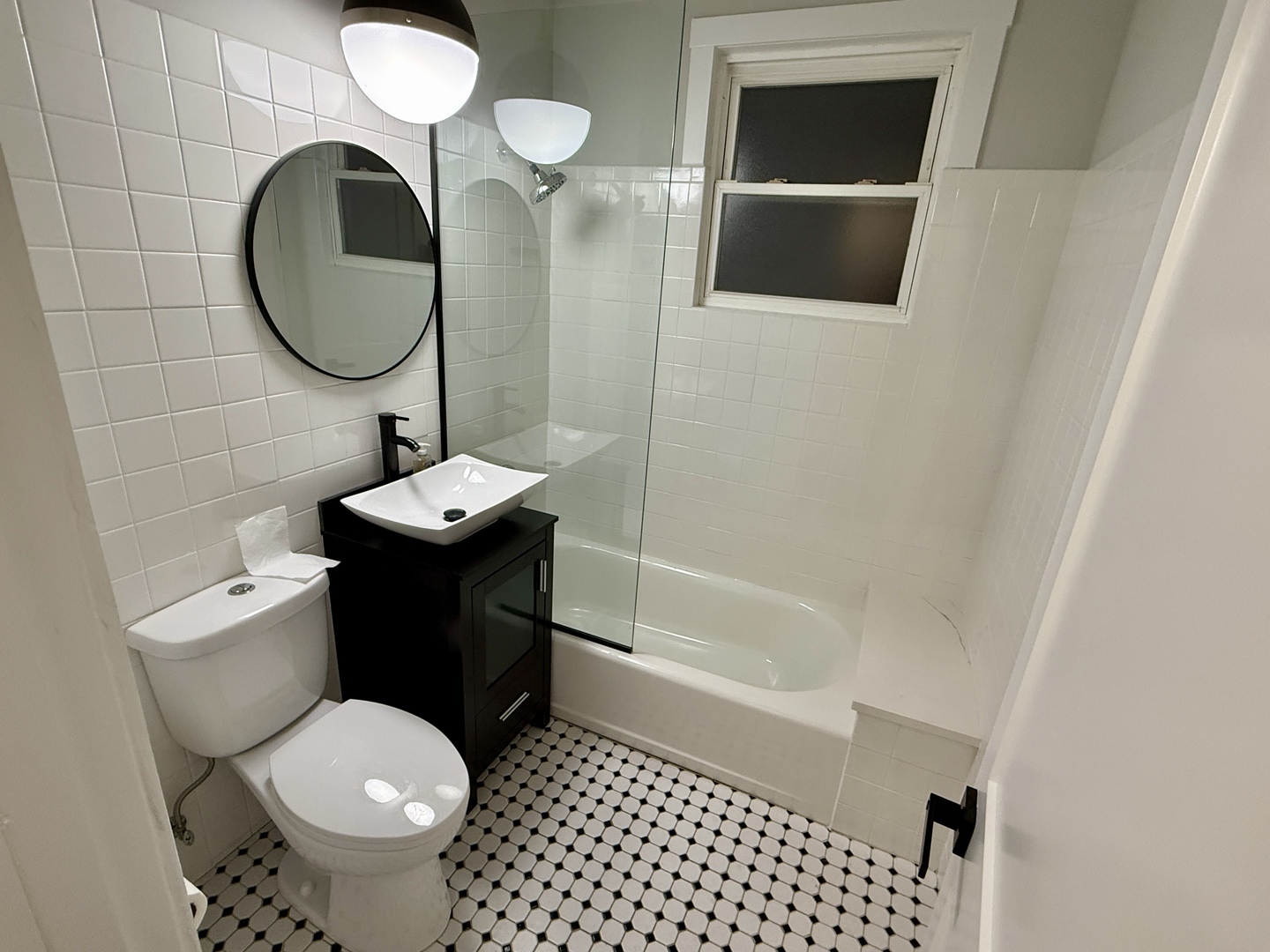 5942 West Eastwood Avenue, Unit 1 Chicago, IL 60630 - Photo 7 of 17 a bathroom with a sink toilet and a mirror