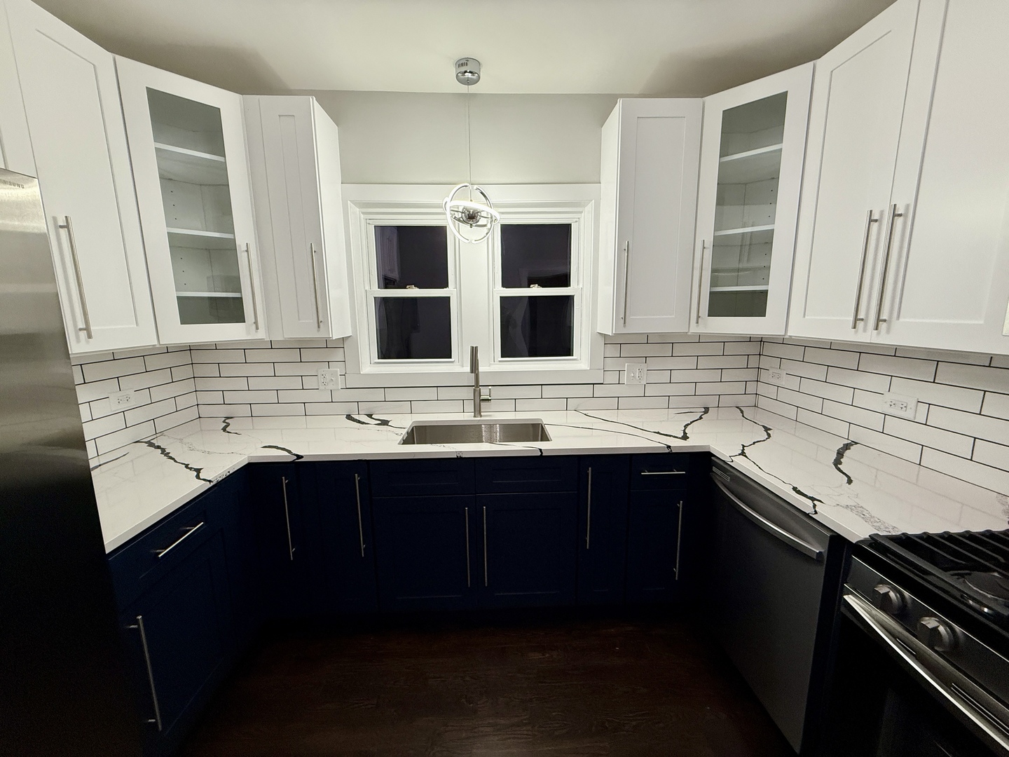 5942 West Eastwood Avenue, Unit 1 Chicago, IL 60630 - Photo 10 of 17 a kitchen with a sink and cabinets