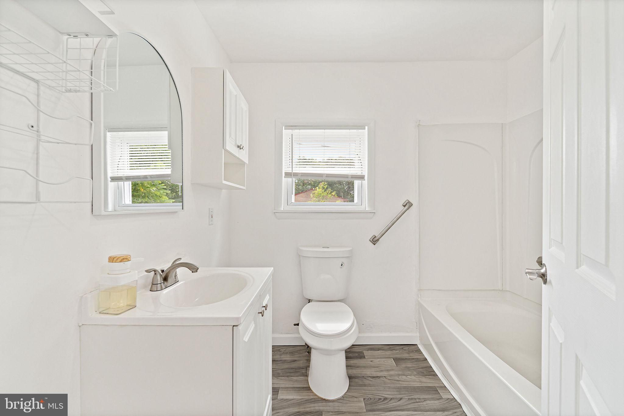 5 Sicklerville Road Sicklerville, NJ 08081 - Photo 12 of 25 a bathroom with a sink a toilet and a bathtub