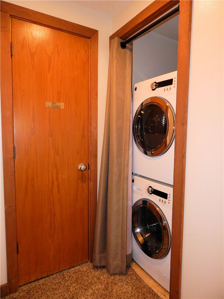 57 Fuller Placer Road, Unit 1B Breckenridge, CO 80424 - Photo 16 of 19 a view of a hallway with washer and dryer