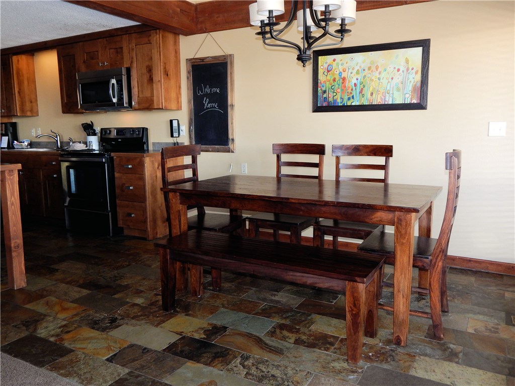 57 Fuller Placer Road, Unit 1B Breckenridge, CO 80424 - Photo 9 of 19 a view of a dining room with furniture