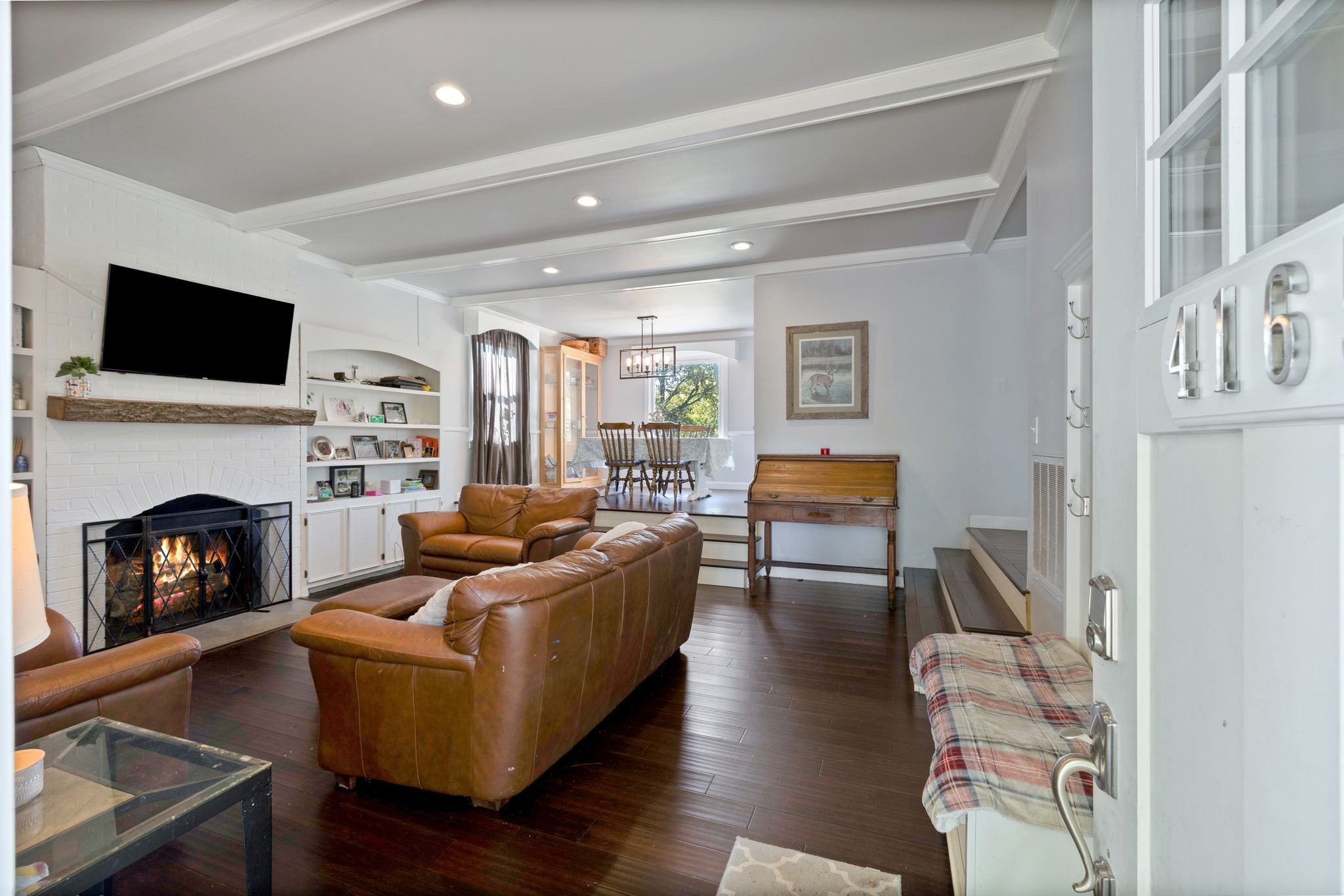 4165 Clovercroft Road Franklin, TN 37067 - Photo 11 of 27 a living room with furniture fireplace and flat screen tv