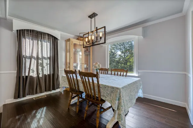 a kitchen with a refrigerator a sink a stove a microwave and cabinets