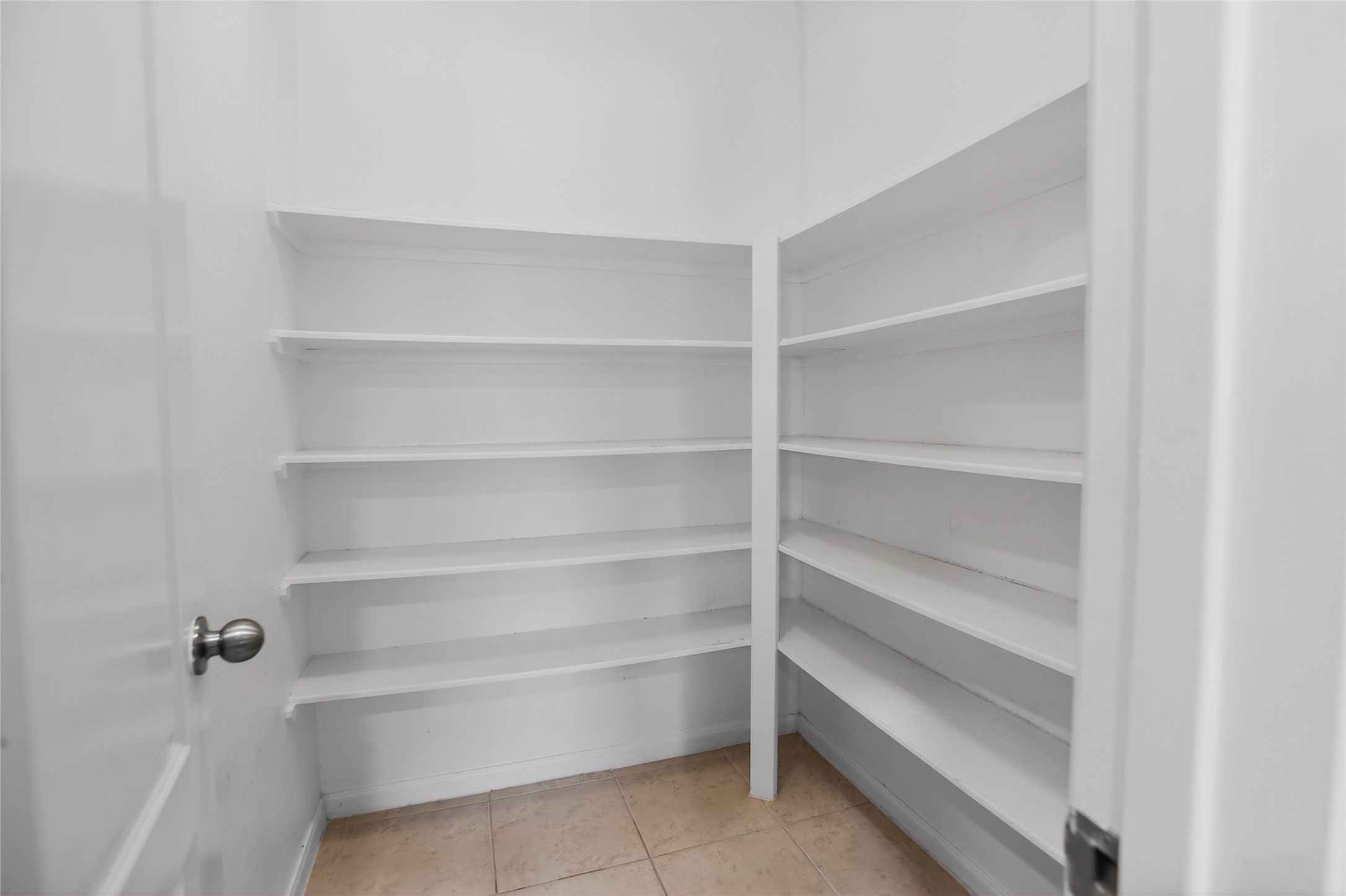 25315 Terrain Park Drive Spring, TX 77373 - Photo 17 of 50 a view of walk in closet with empty racks