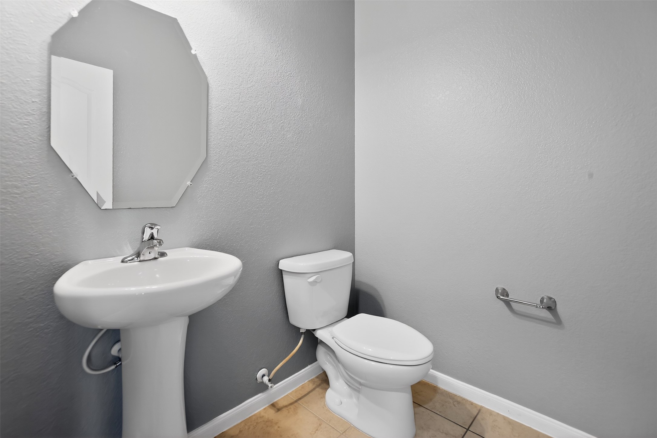 25315 Terrain Park Drive Spring, TX 77373 - Photo 20 of 50 a bathroom with a sink a mirror and a toilet