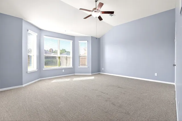 an aerial view of a house with swimming pool and outdoor space