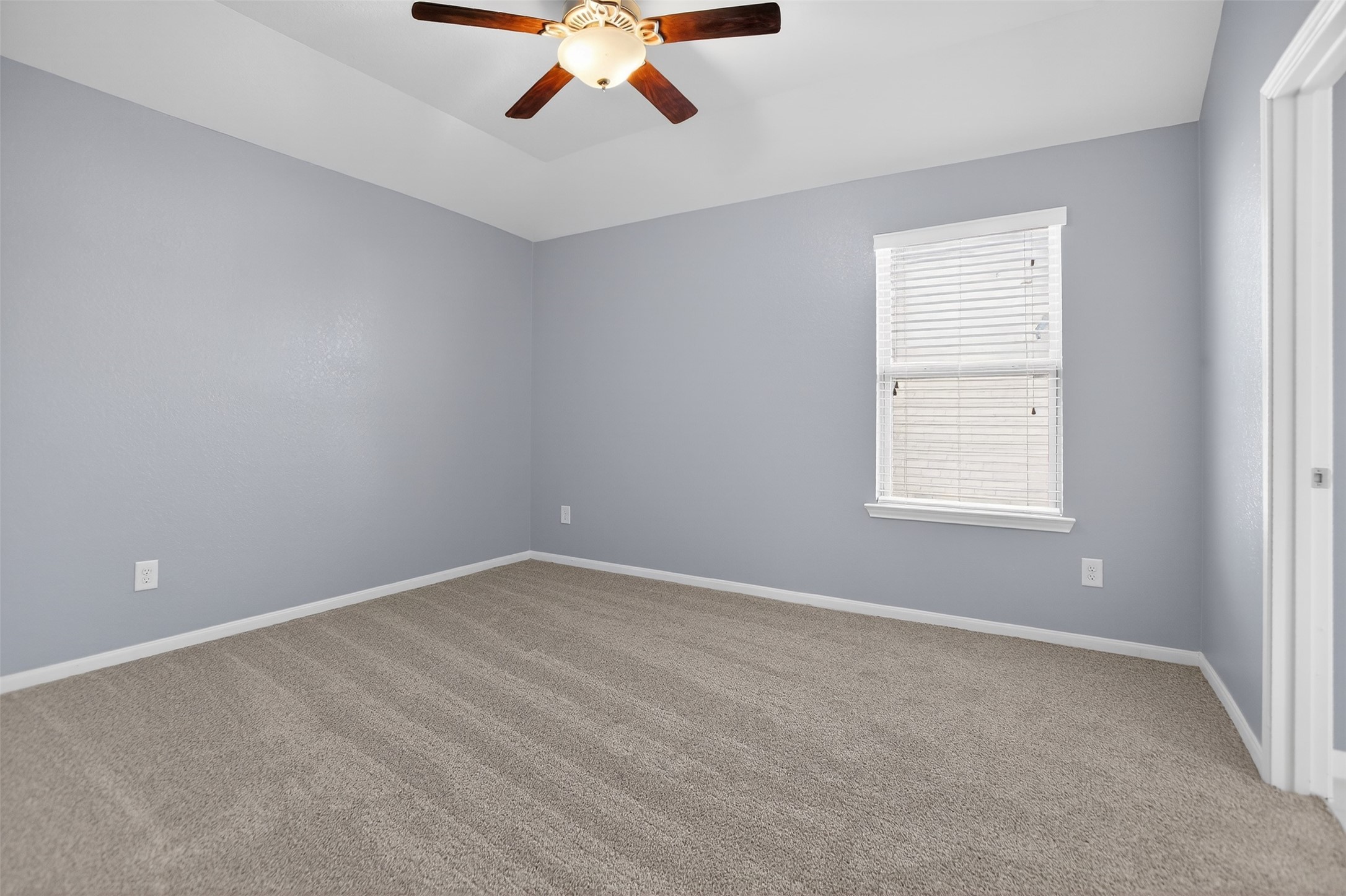 25315 Terrain Park Drive Spring, TX 77373 - Photo 27 of 50 an empty room with a window and a fan