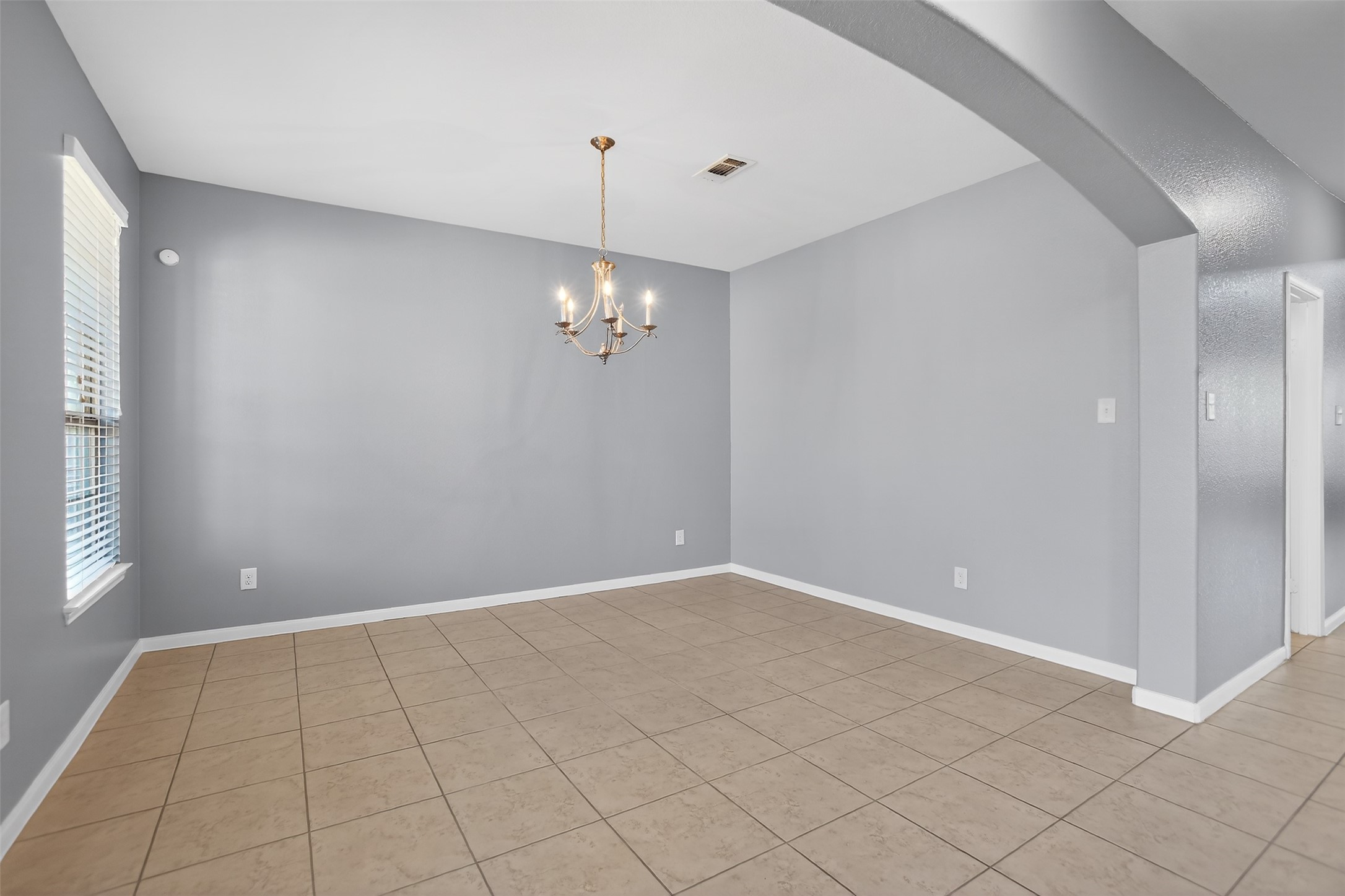 25315 Terrain Park Drive Spring, TX 77373 - Photo 4 of 47 an empty room with chandelier fan
