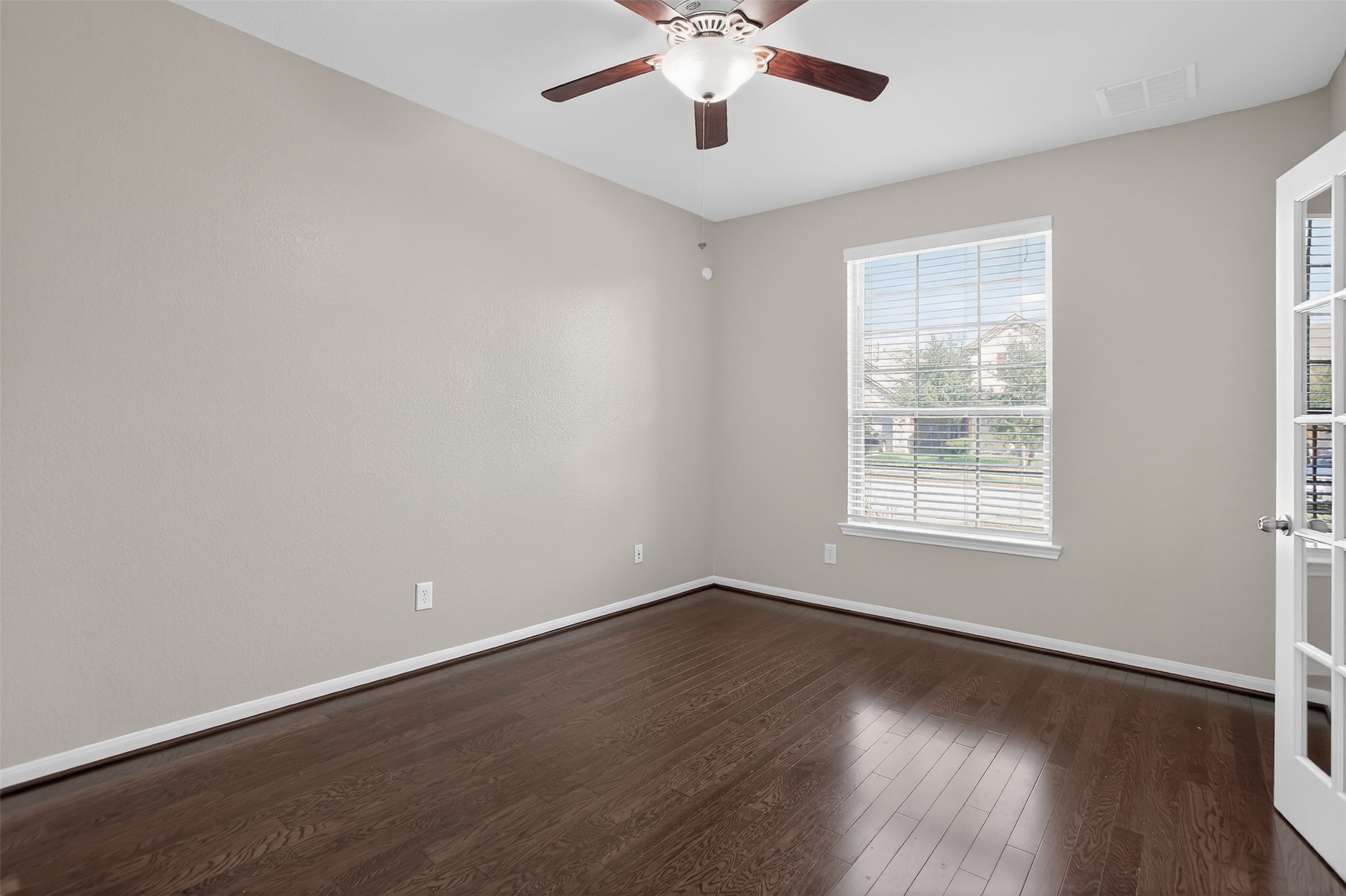 25315 Terrain Park Drive Spring, TX 77373 - Photo 9 of 50 a view of a room with wooden floor and windows